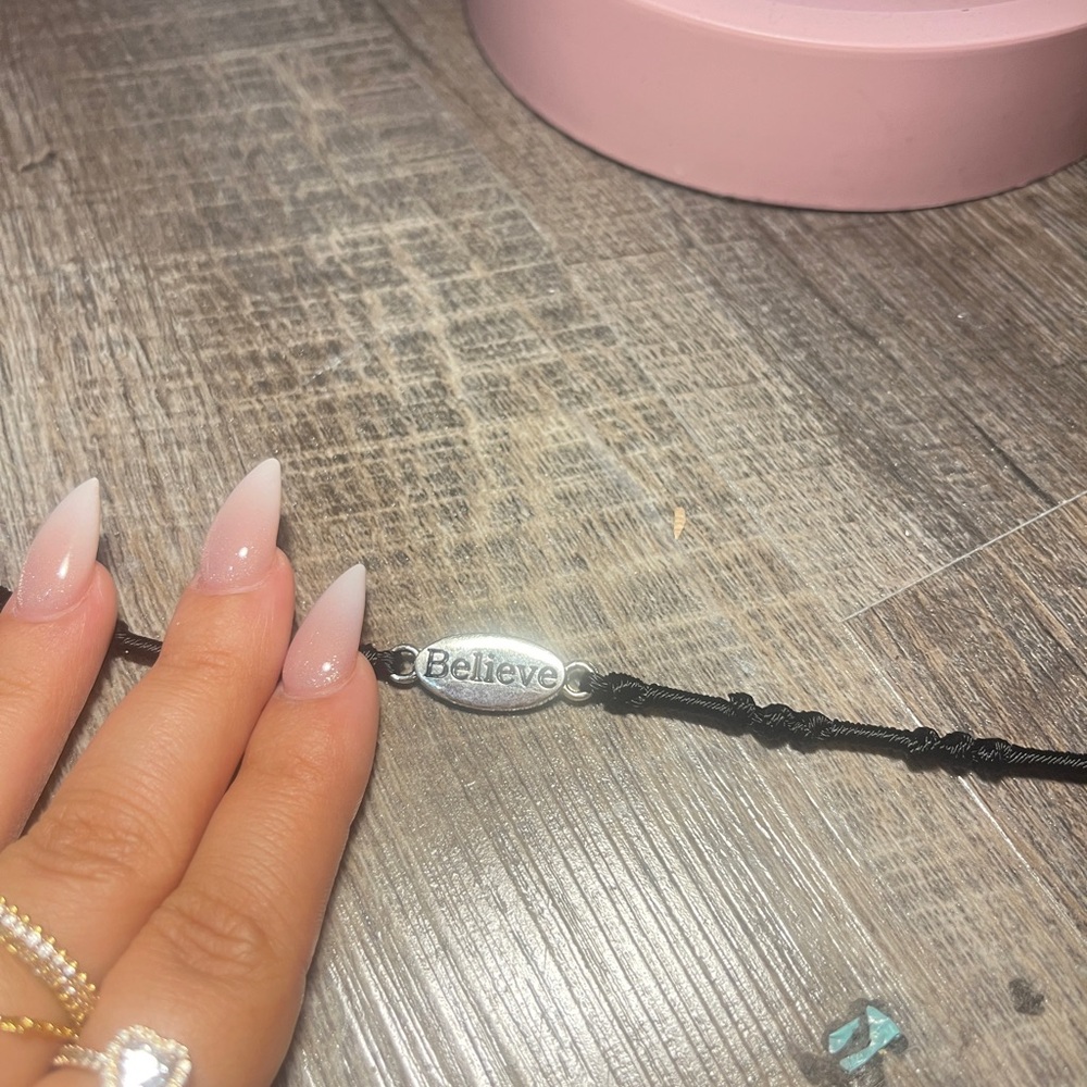 Black Bracelet with 'Believe' Charm